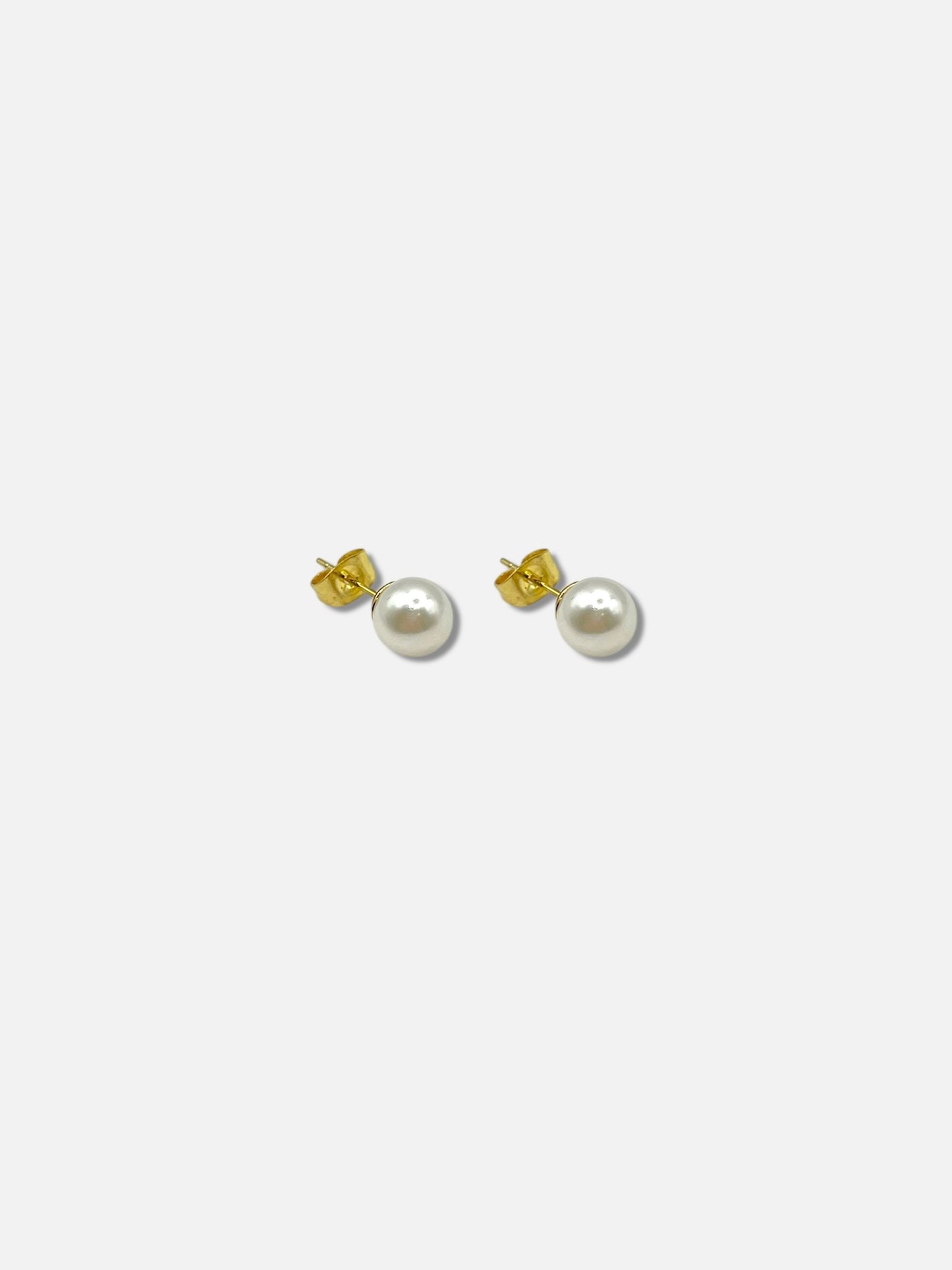 Aretes perla.