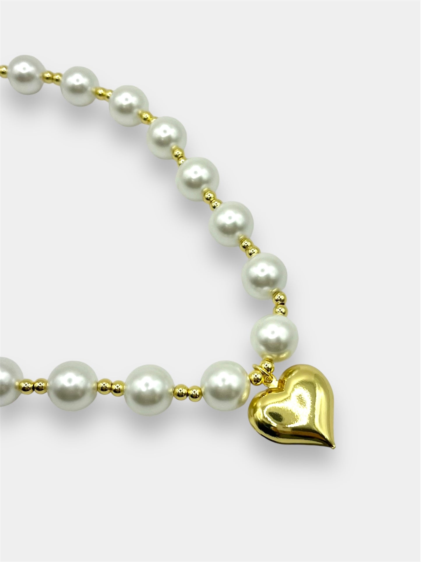 Collar perlas corazón.