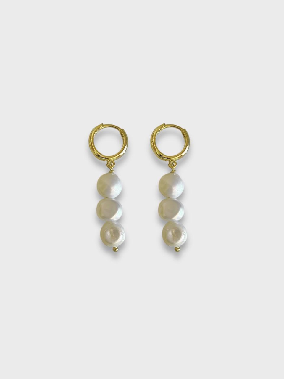 Aretes perlas.