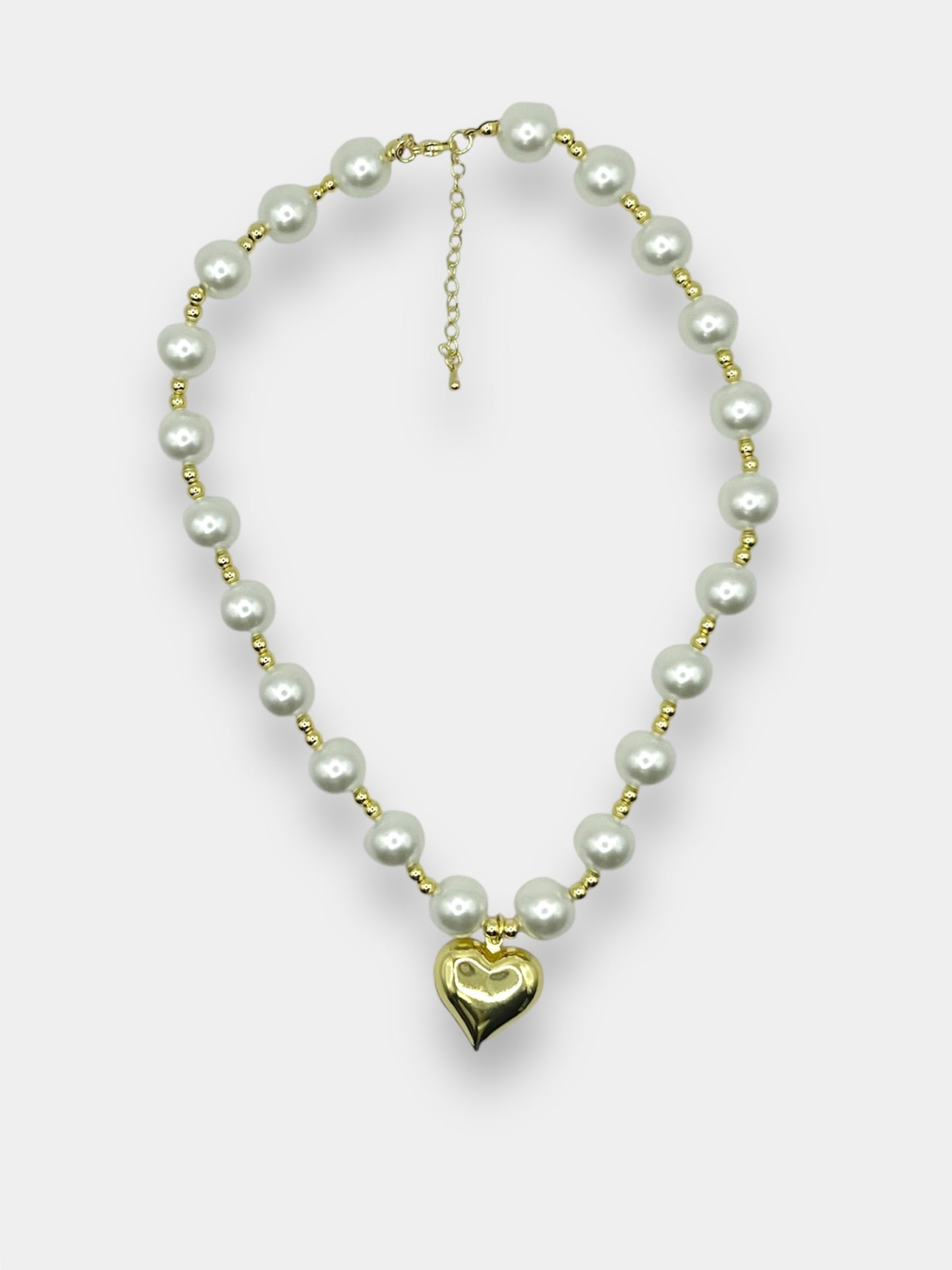 Collar perlas corazón.